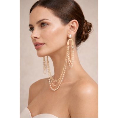 Gold-tone pearl earlace with cascading layered pearl chains and oval pearl accents, statement ear jewelry by Anamae