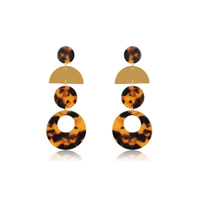 Add a classic touch to any outfit by wearing these on-trend brown tortoiseshell earrings. Geometric gold and Tortoiseshell Drop Earrings are a perfectly trendy look that's never going out of style! These chic earrings feature three circle charms shaped from tartarooga print plexi and a mat 24K gold-plated semi-circle. They are lightweight, durable and suitable to wear from day through the night.