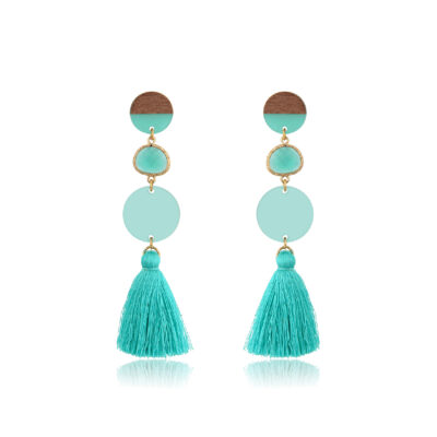 Rosewood and plexi combination creating a chic and sleek tassel earrings. A round stud, a crystal and a plexi disk ending with a long mint tassel, creating a fun and fringy look. Because they're so light, they offer you the comfort you look for in a jewelry. Add the perfect minimalist touch to any outfit with these eco-friendly earrings.