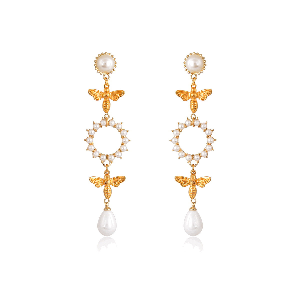 Elegant and chic, this pair of earrings is elegantly subversive and captures the spirit of the women of taste. Playing with metal, pearls and proportions, these pearl earrings are perfectly balance and cradled by 24K gold-plated little bees. Just what you need to make a difference night and day. Prefect for a wedding day, or any formal occasion.