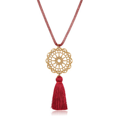 Fall in love with our exquisite pendant featuring a captivating mandala design motif. Adorned with a chunky tassel at the bottom and complemented by a stunning burgundy double snake chain, this piece is the perfect accessory to enhance your favorite Bohemian outfit. It's a true showstopper and one of our favorite creations. Embrace the beauty and charm of this pendant and let it become a beloved addition to your jewelry collection.