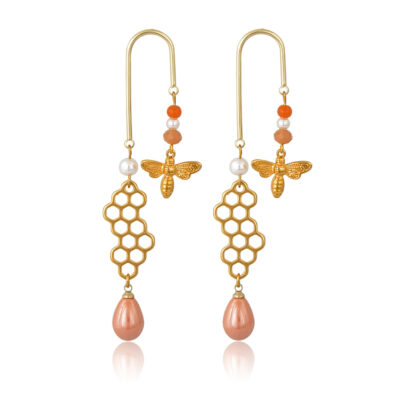 Play all day and party all night in these honeycomb pearl and bees 18k gold-plated earrings. Geometric earrings with pearls, jade beads and 24K gold-plated bee on one side and honeycomb and a delicious peach drops on the other.