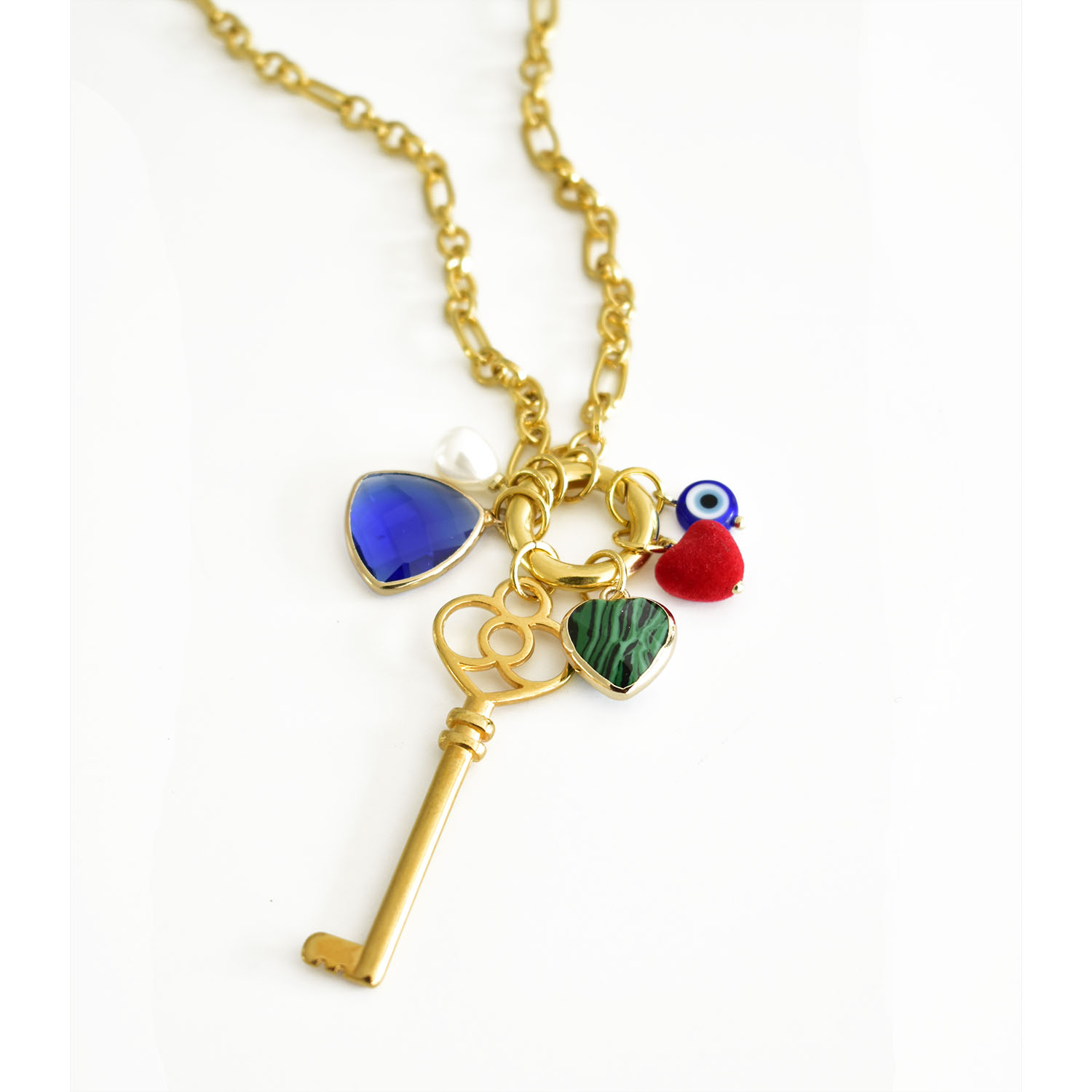 Protect yourself with this splendid necklace! Get yourself seduced by this conspicuous lucky key pendant. This unique piece of jewelry is a powerful talisman and is here to bring you luck. Made of high-quality 24k gold-plated brass, his stainless-steel chain is giving it a special value. The charms surrounding the key are there to reinforce his power. The stones in different tones are creating a tempting color combination. Wear this key pendant with any minimalist Anamae necklace to attract good vibes and open doors to happiness.