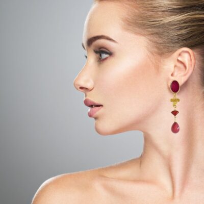Make a statement in a stunning fashion earrings. There's no better way to express yourself than with a unique earring design. From our “All Greek to me” collection. These Greek-chic earrings feature a 24 k gold-plated ionic column, set with a deep red teardrop. All that beauty is hanging from an oval enameled stud.