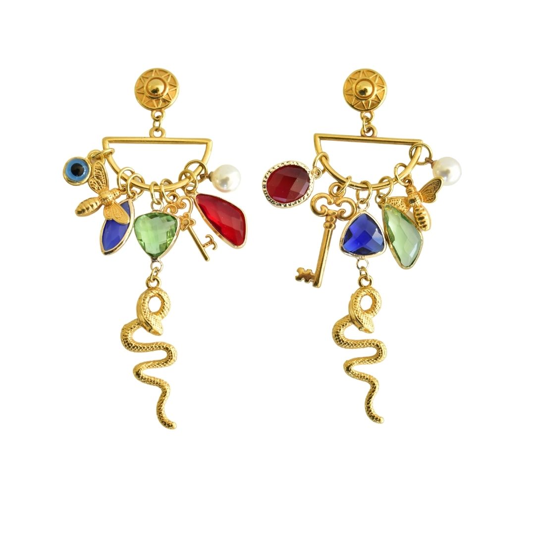 Protect yourself with these magnificent earrings! Allow yourself to be seduced by these eye-catching talisman earrings. This one-of-a-kind pair of earrings is a powerful talisman that will bring you good fortune. His snake charm adds a special touch to this piece, The charms that surround the snake serve to increase his power, they’re all made of high-quality 24k gold-plated brass. The stones in various tones create an enticing color combination. Wear this pair with any Anamae protection jewelry, to attract positive energy and open doors to luck and happiness.