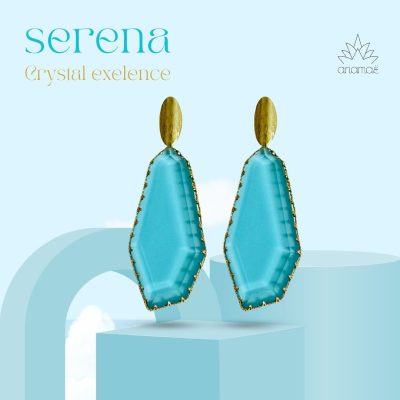 Make waves with these stunning aquamarine earrings! The perfect blend of boldness and beauty, framed in gold for an extra touch of luxury. These geometric aquamarine earrings are a striking addition to any jewelry collection. The large aquamarine crystals are beautifully framed with a gold ream, enhancing their natural sparkle and color. The design features a narrow gold oval matte stud, adding a modern and elegant touch. Perfect for making a statement, these earrings combine contemporary design with timeless elegance.