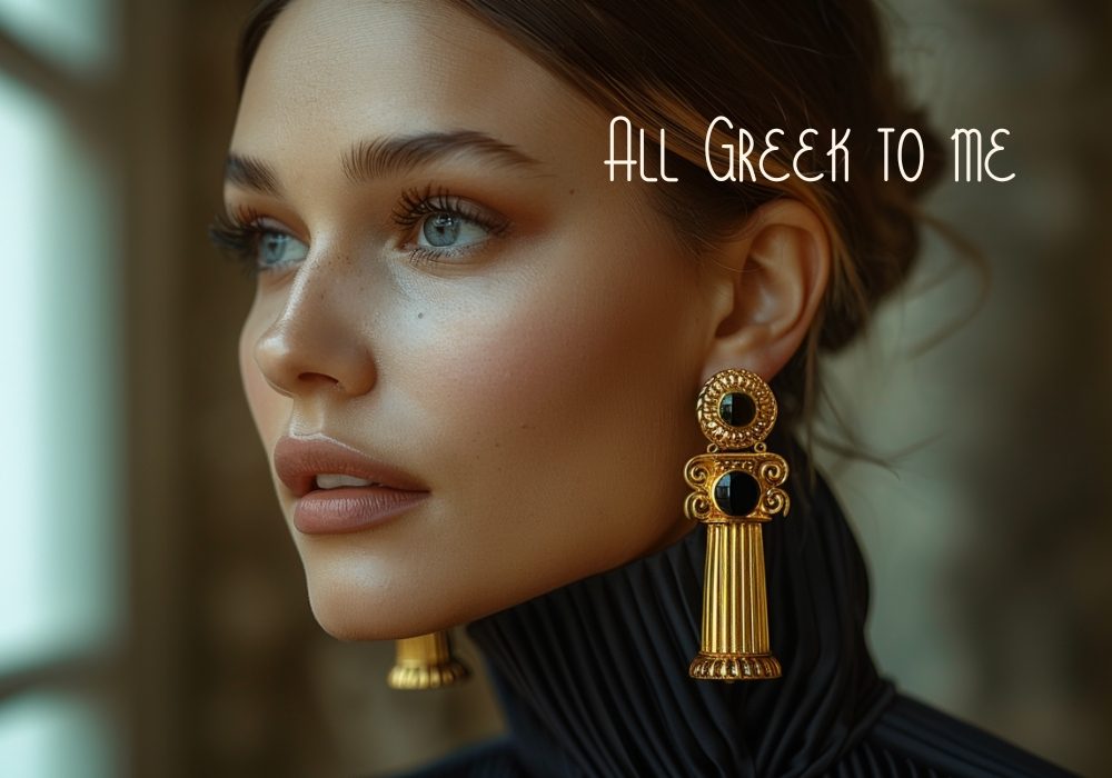 a young woman is wearing long gold ionic columns pair of earrings,